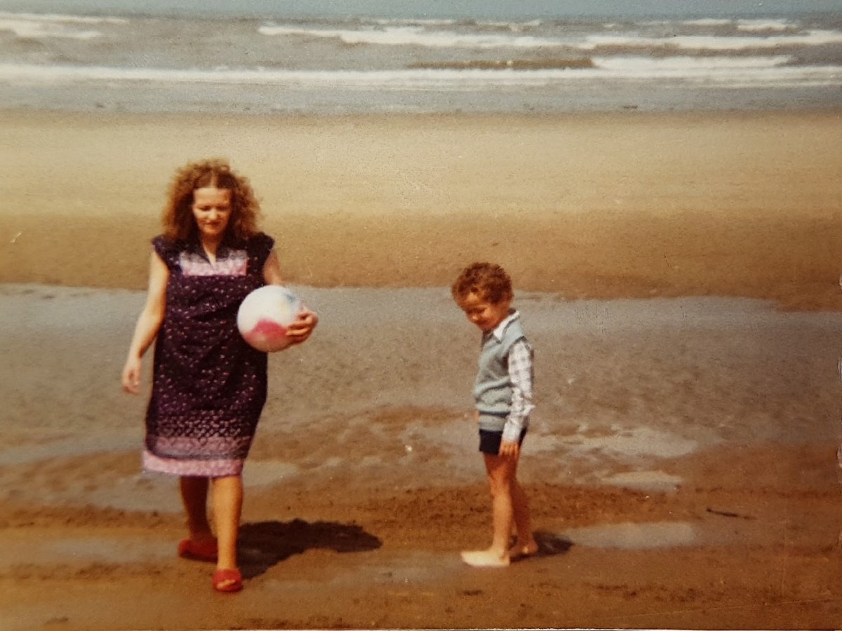 A young Michael with his mum, Jean, on the beach